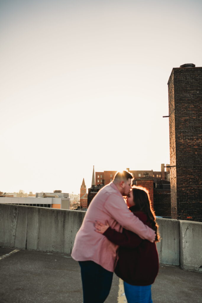 Capturing Love and Emotion: Moody and Romantic Engagement Portraits in Downtown Erie and Pittsburgh, PA by Rylee Louisa Photography. Specializing in Candid Moments on Rooftop Parking Garages, this Wedding and Couples Photographer beautifully portrays the Emotional Essence of Love in Urban Landscapes.