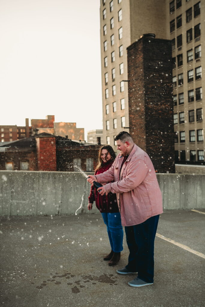 Capturing Love and Emotion: Moody and Romantic Engagement Portraits in Downtown Erie and Pittsburgh, PA by Rylee Louisa Photography. Specializing in Candid Moments on Rooftop Parking Garages, this Wedding and Couples Photographer beautifully portrays the Emotional Essence of Love in Urban Landscapes.