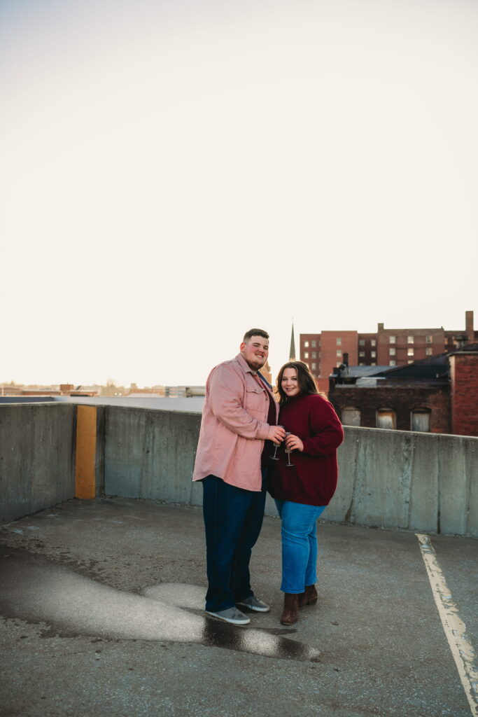 Capturing Love and Emotion: Moody and Romantic Engagement Portraits in Downtown Erie and Pittsburgh, PA by Rylee Louisa Photography. Specializing in Candid Moments on Rooftop Parking Garages, this Wedding and Couples Photographer beautifully portrays the Emotional Essence of Love in Urban Landscapes.