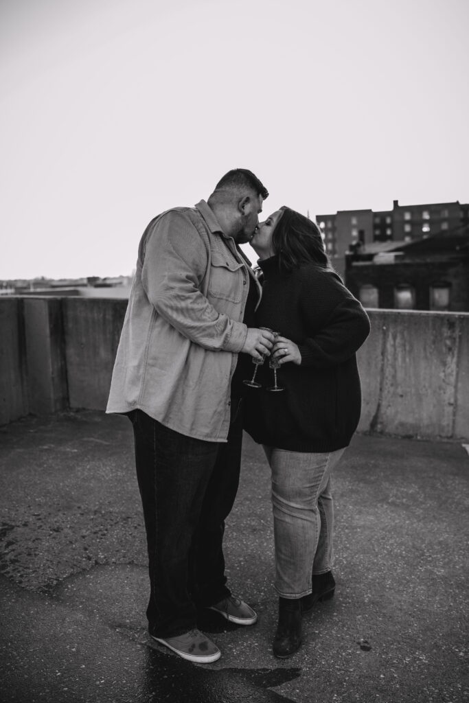 Capturing Love and Emotion: Moody and Romantic Engagement Portraits in Downtown Erie and Pittsburgh, PA by Rylee Louisa Photography. Specializing in Candid Moments on Rooftop Parking Garages, this Wedding and Couples Photographer beautifully portrays the Emotional Essence of Love in Urban Landscapes.