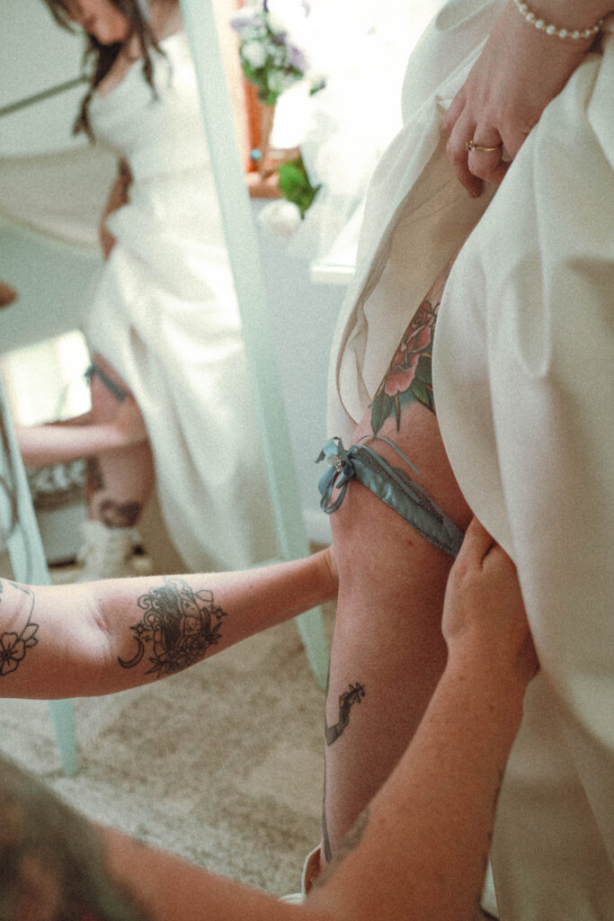 Intimate queer wedding moment captured in soft, natural light with a documentary approach