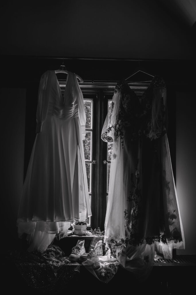 Modern queer wedding detail shots including rings, jewelry, and personal items styled naturally