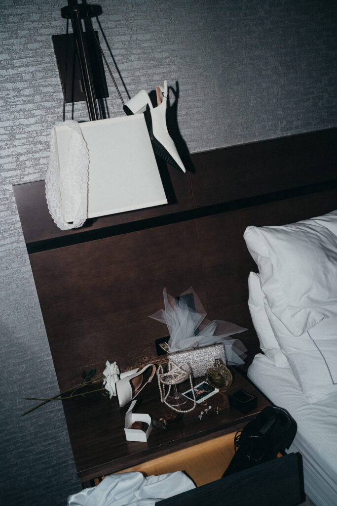 Editorial flash wedding photography capturing a queer couple in a raw, unposed moment