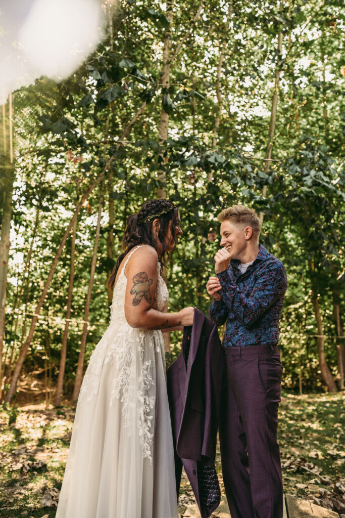 Queer couple fully dressed together before their ceremony, intimate wedding photography moment