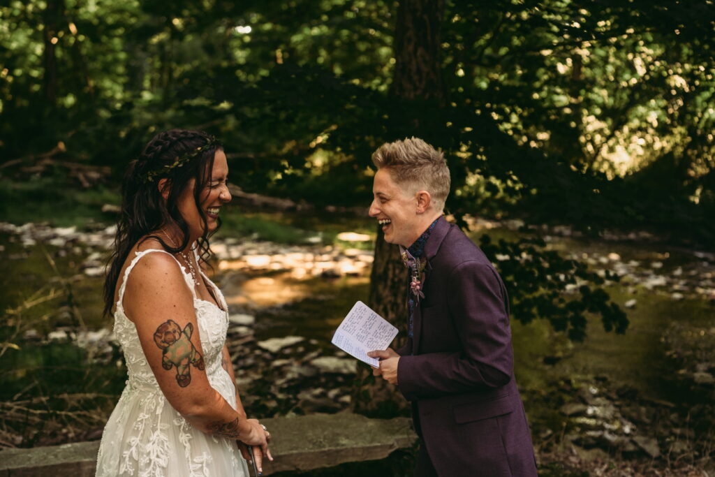 Queer couple privately reading vows together during their wedding day, photographed with a documentary wedding photo film approach